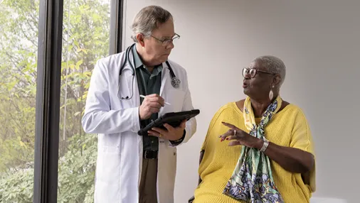 Patient Joy talking to a doctor