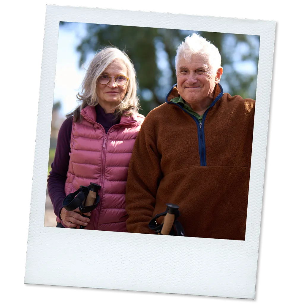 Polaroid of James, a real TAVR patient, standing outside next to a woman