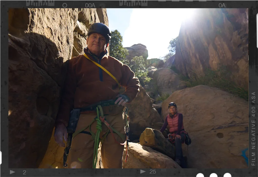 James, a real TAVR patient, mountain climbing with a woman in the background